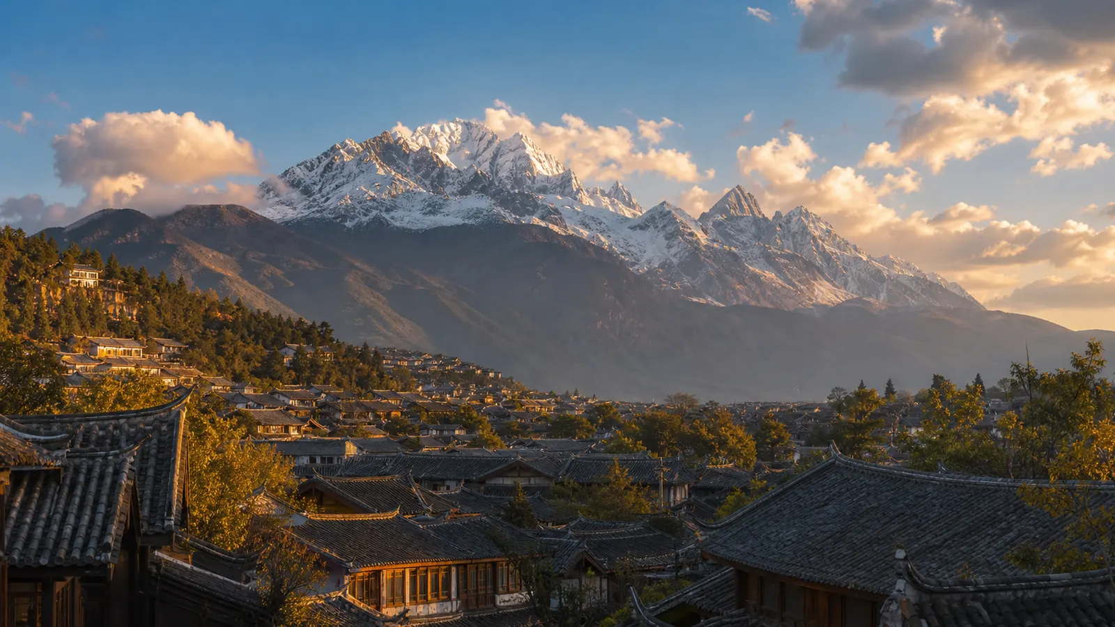 Lijiang rooftops below Jade Dragon Snow Mountain in Yunnan